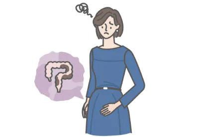 便秘症の若い女性（下腹部が張り、ドレスが上